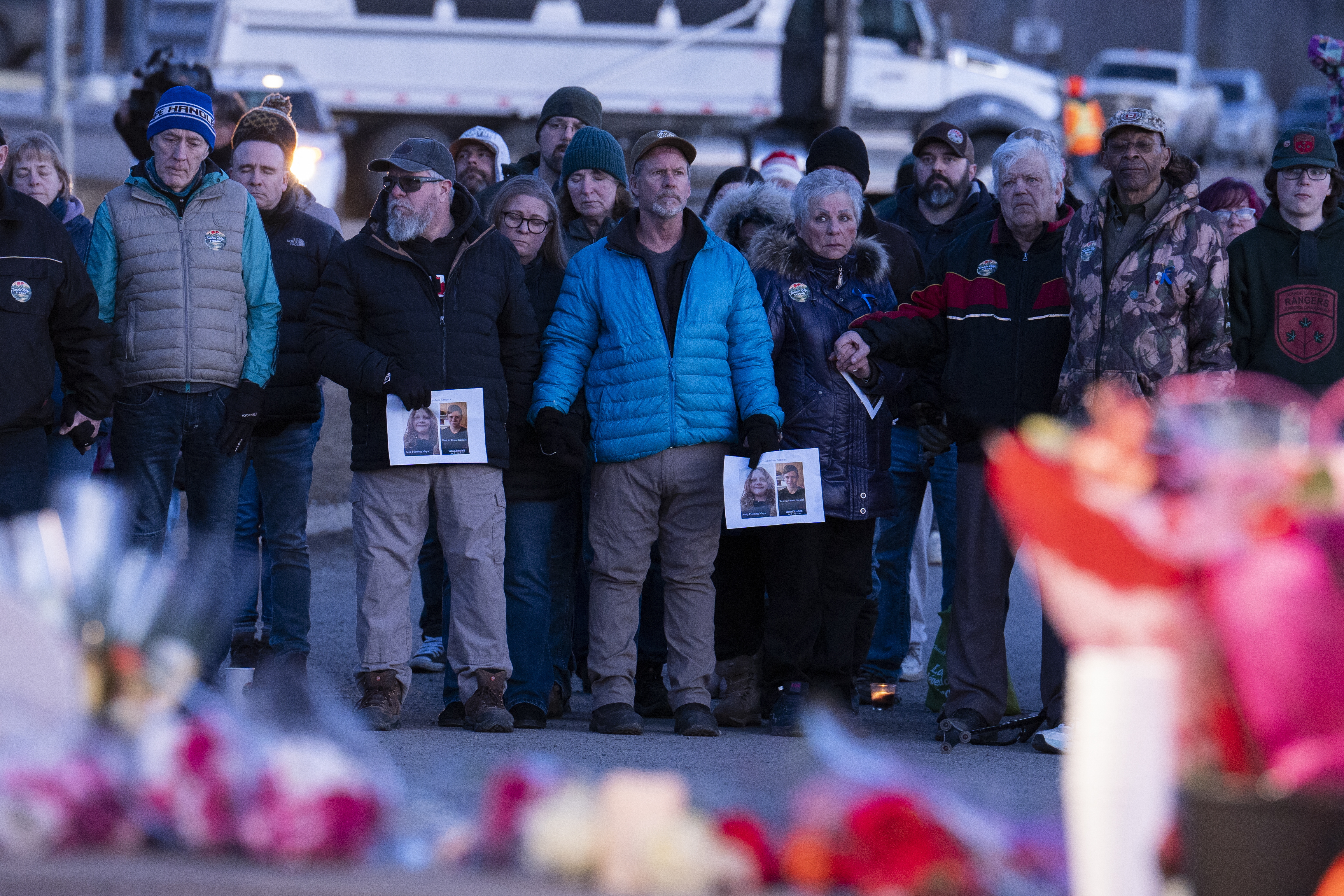 Community members attend a vigil to honor the victims of one of Canada